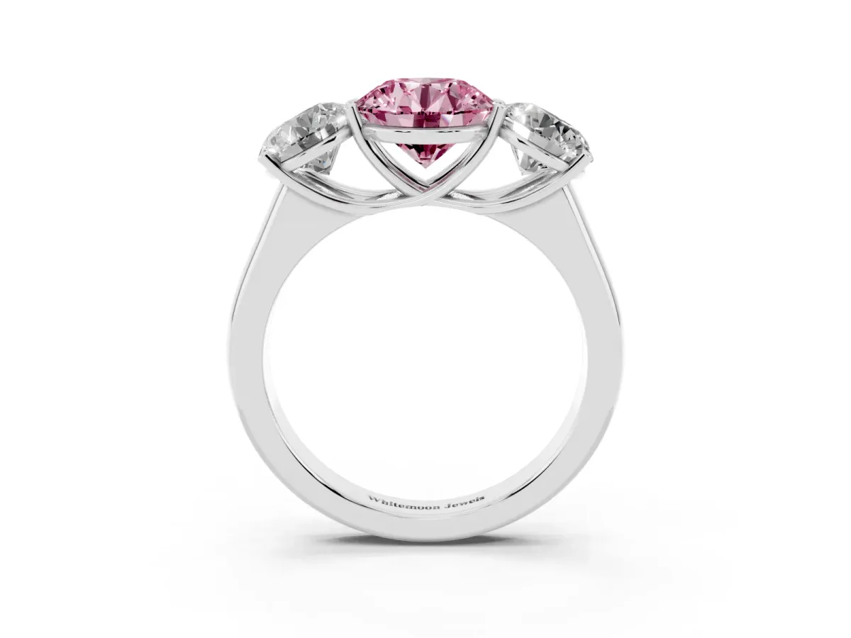 Fancy Pink Round Cut Three-Stone Diamond Ring with Prong Setting on a Classic Band Platinum
