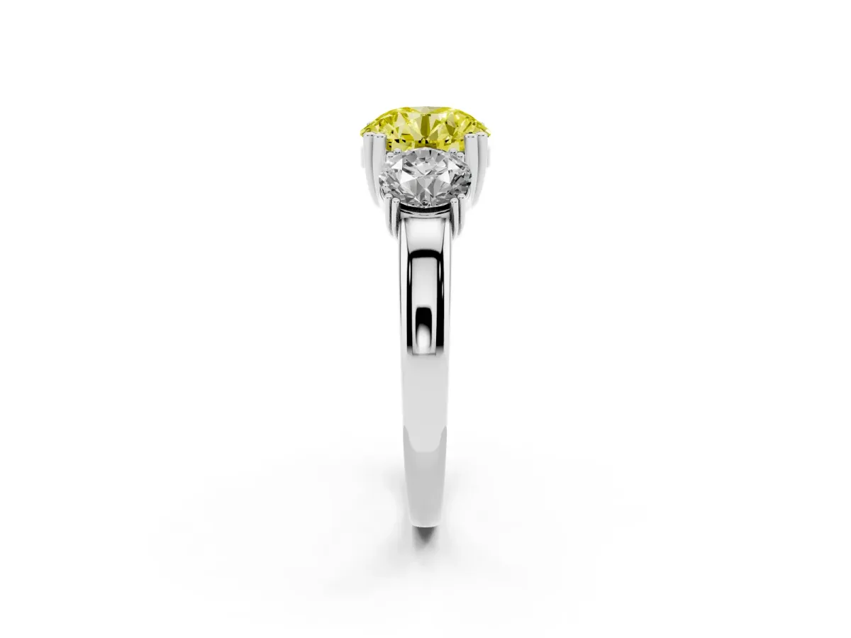Fancy Yellow Three-Stone Round Cut Cut Diamond Ring with Channel Set Band and Four-Prong Setting Platinum