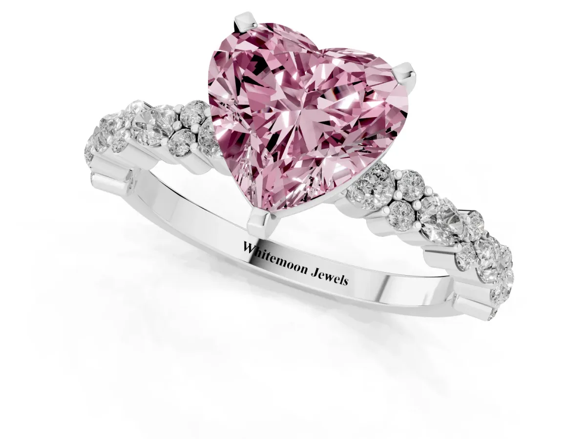 Fancy Pink Heart Cut Diamond Side Stone Solitaire Ring with Round and Four-Prong Setting Platinum