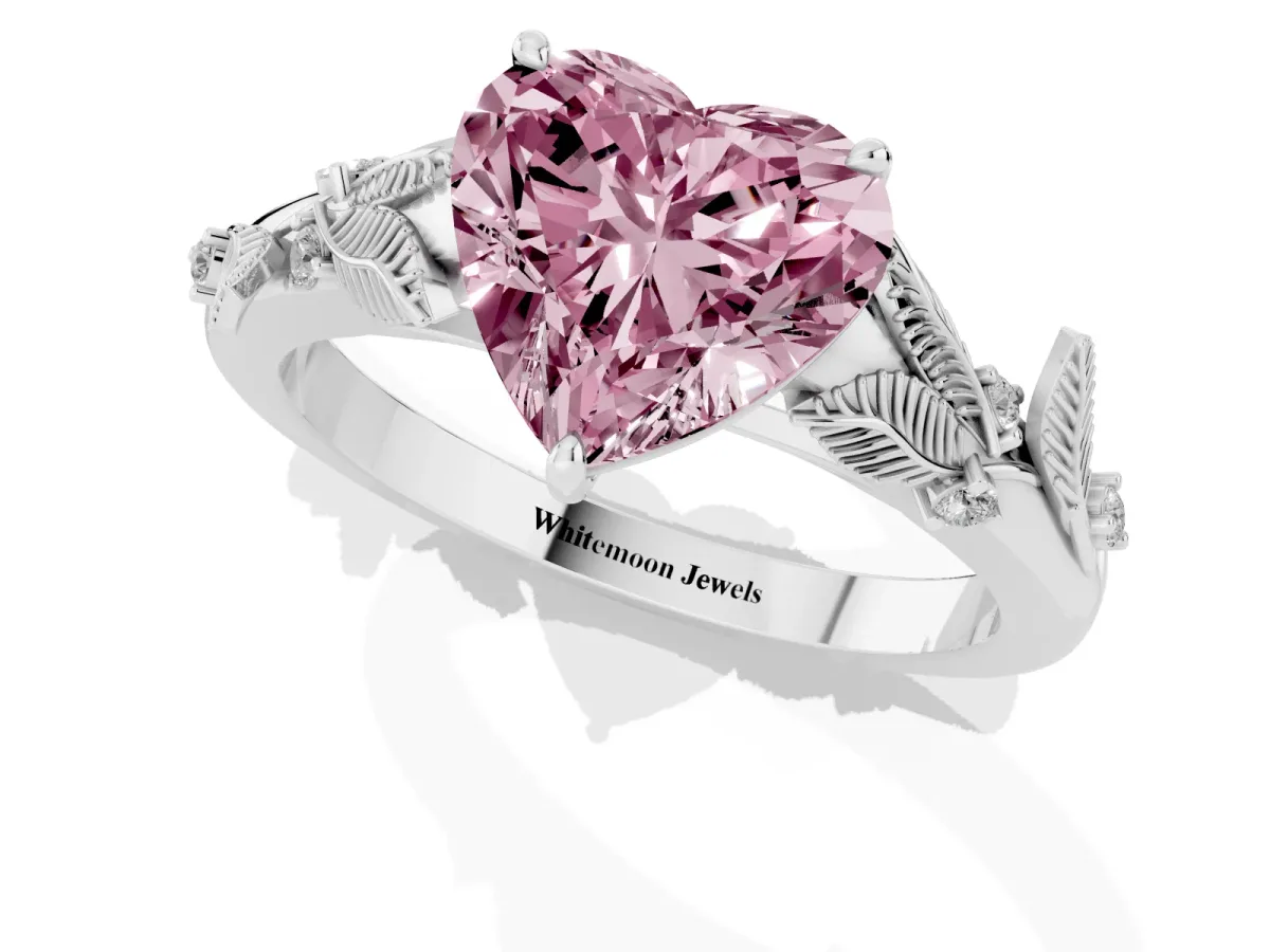 Fancy Pink Heart Cut Diamond Solitaire Ring with Leaf Motif Band and Four-Prong Setting Silver