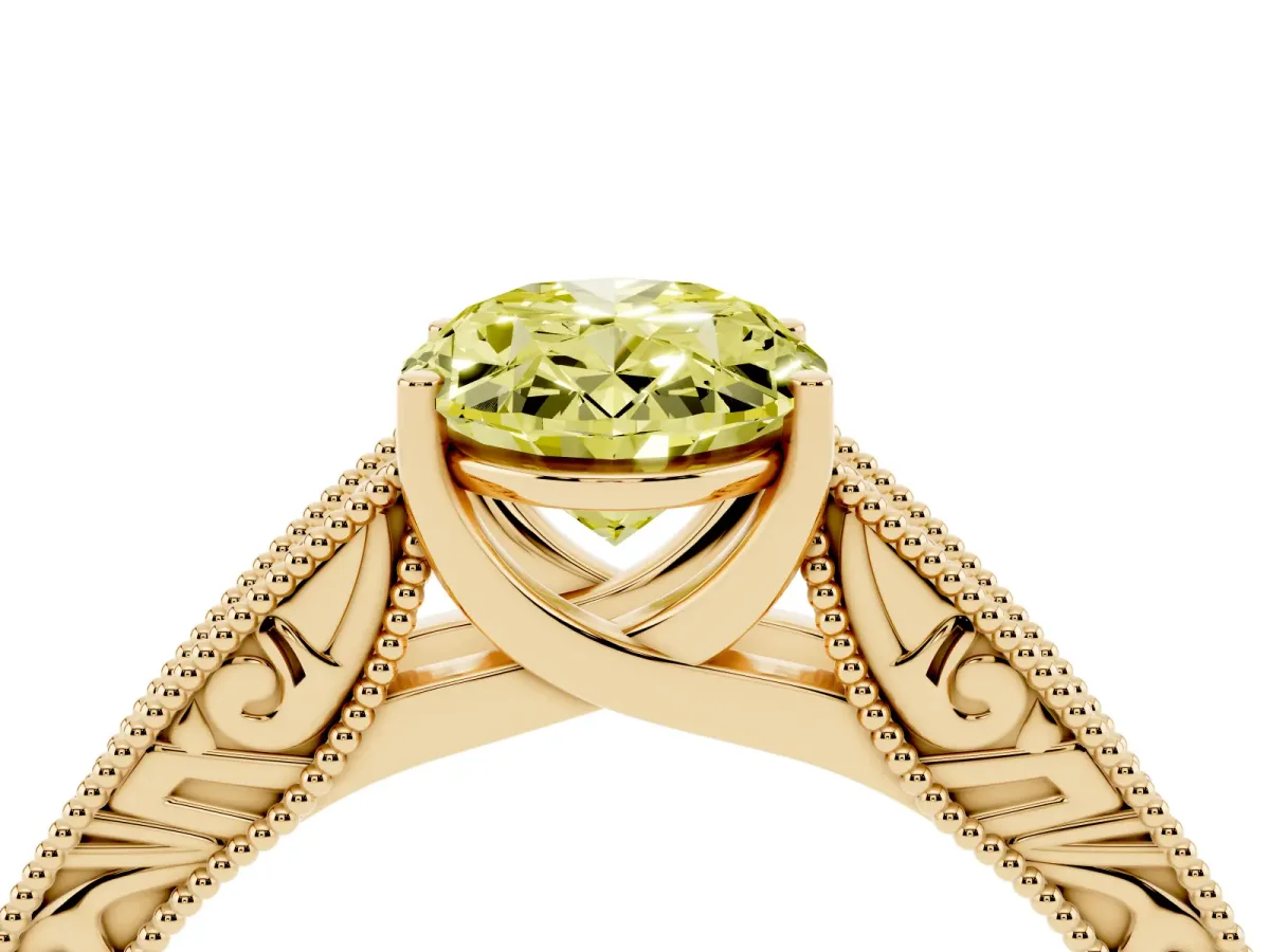 Fancy Yellow Oval Cut Diamond Solitaire Ring with Engraved Band and Four-Prong Setting Yellow gold