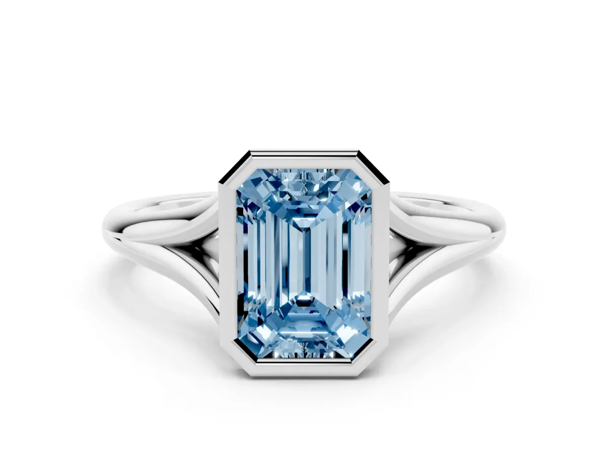 Fancy Blue Bezel Set Emerald Cut Cut Solitaire Ring with Tapered Band Silver