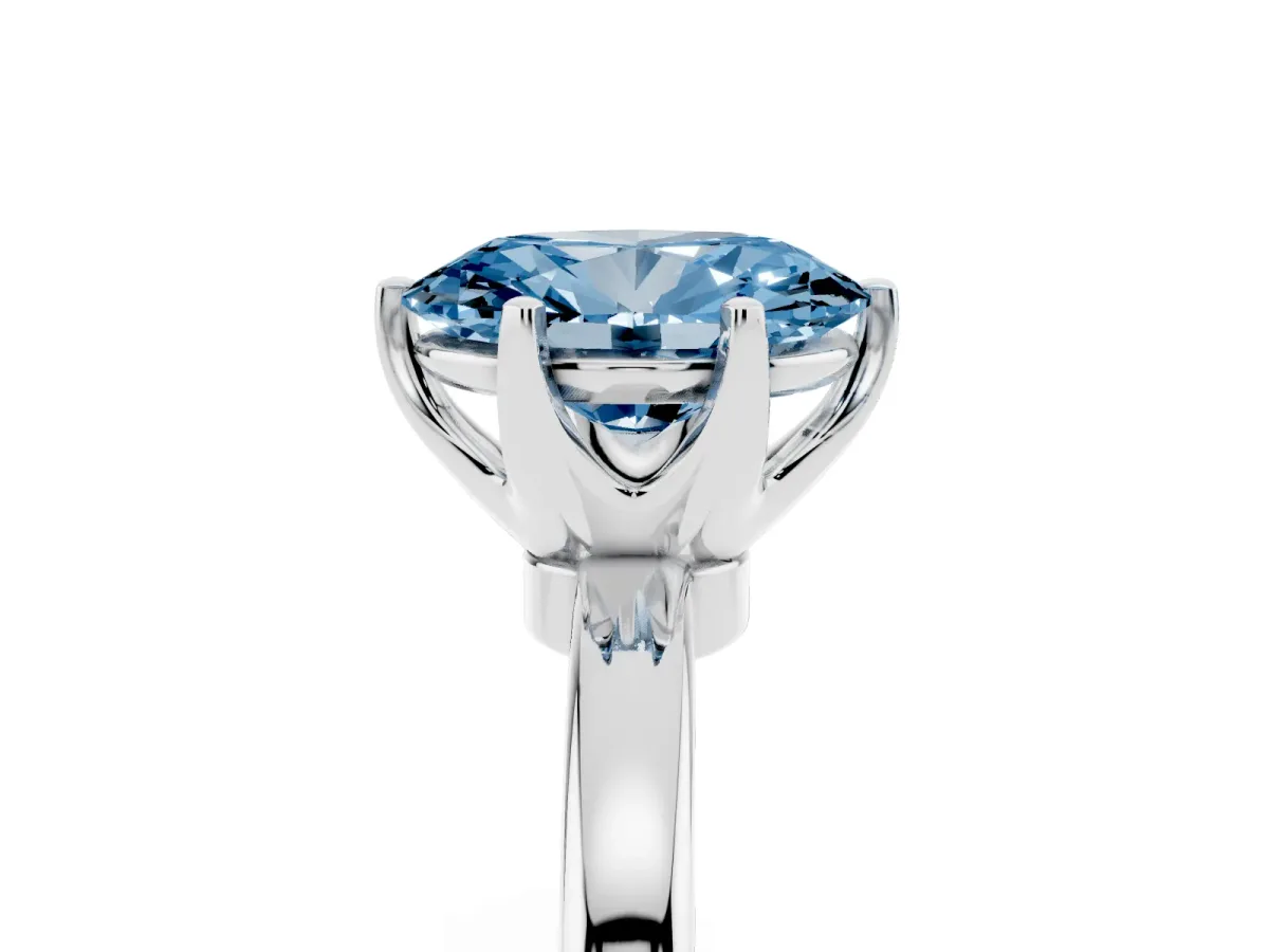 Fancy Blue Oval Cut Solitaire Diamond Ring with Six-Prong Setting on a Classic Band Silver