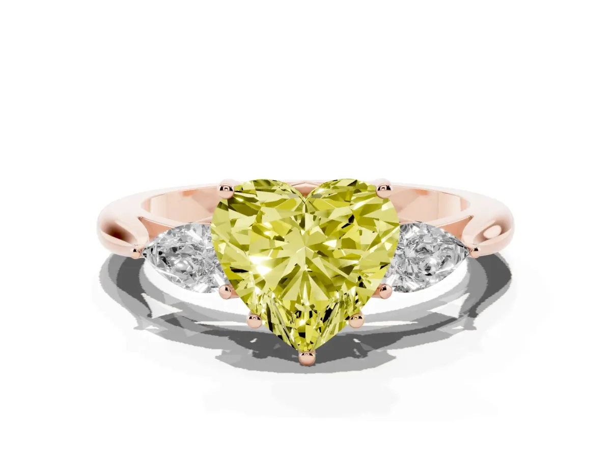Fancy Yellow Three-Stone Heart Cut Brilliant Diamond Solitaire Ring with Tapered Band and Four-Prong Setting Rose gold