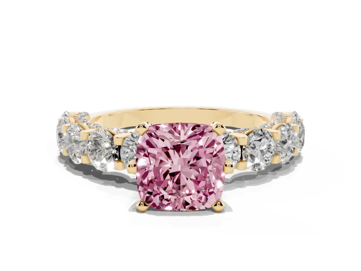 Fancy Pink Cushion Cut Diamond Side Stone Engagement Ring with Four-Prong Setting Yellow gold