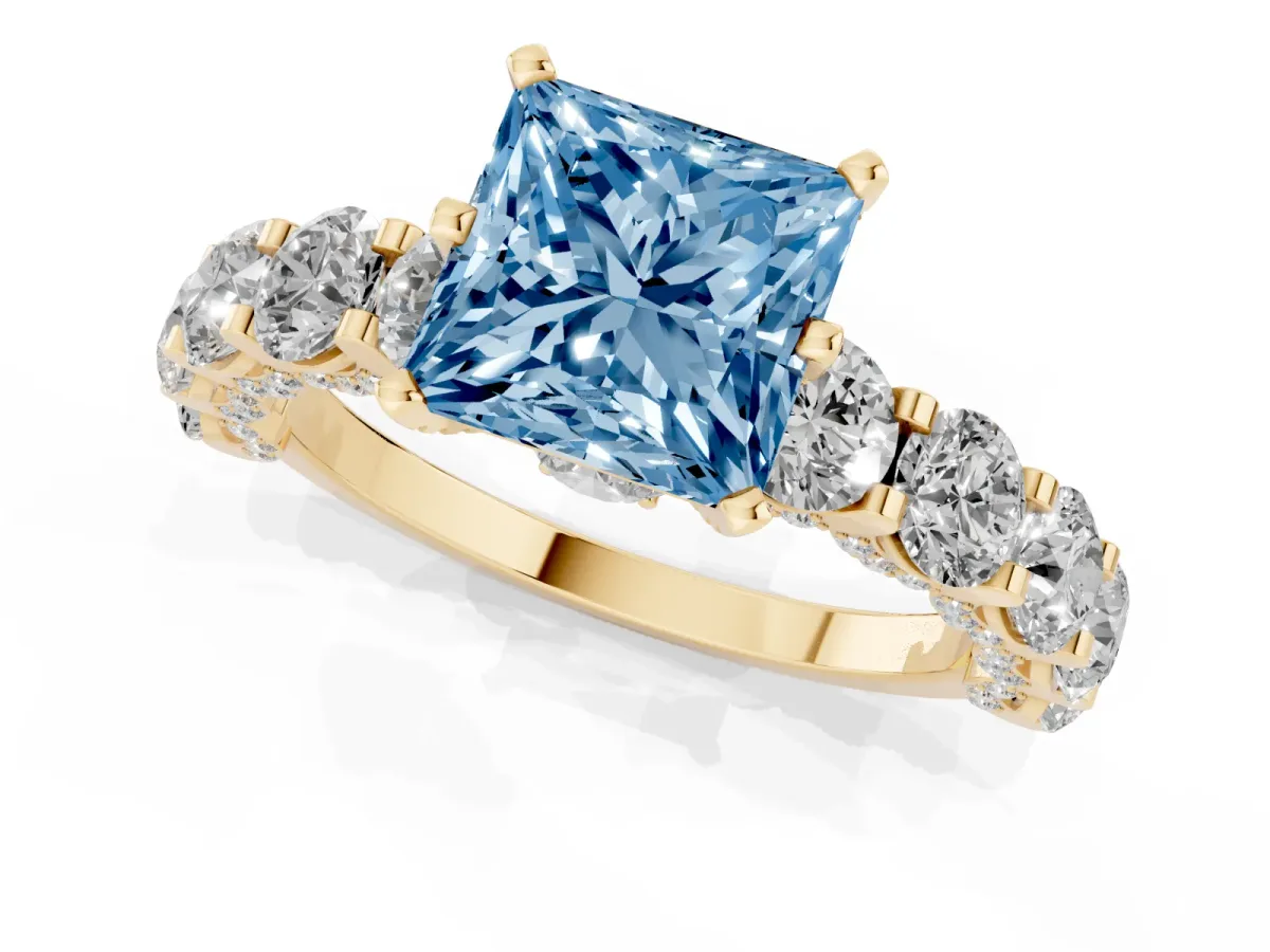 Fancy Blue Princess Cut Diamond Side Stone Engagement Ring with Four-Prong Setting Yellow gold