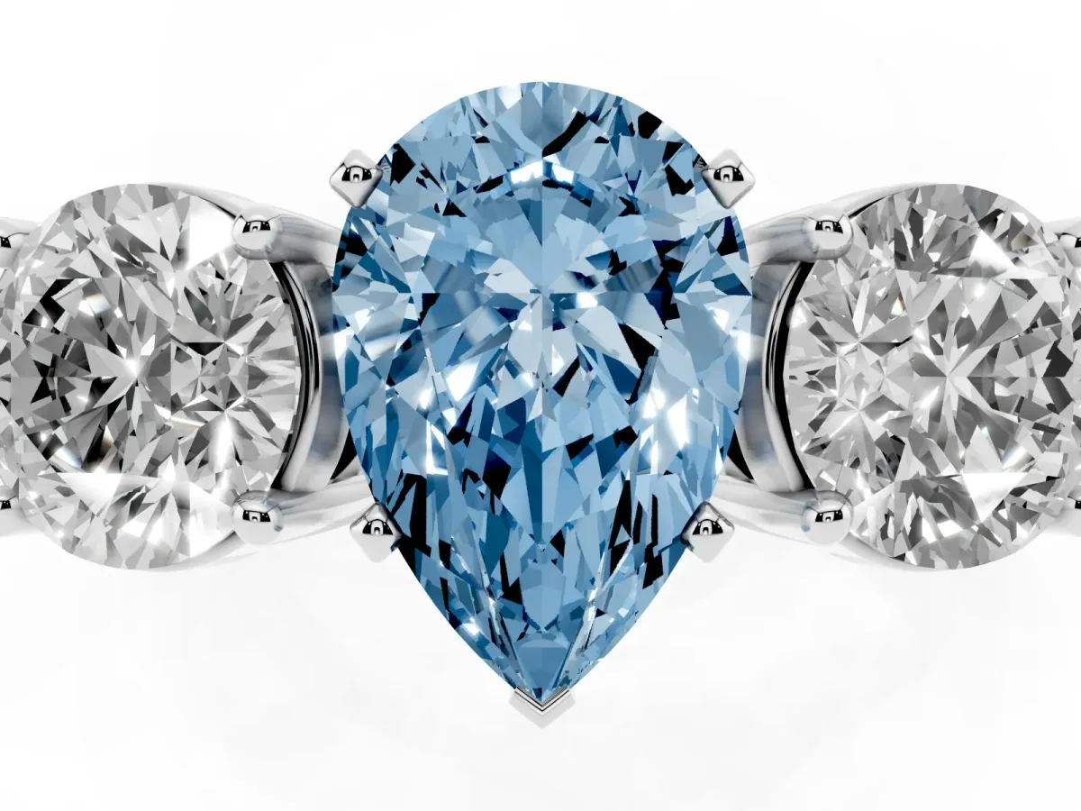 Fancy Blue Three-Stone Pear Cut Diamond Ring with Round Side Stones, Classic Band, and Four-Prong Setting White gold