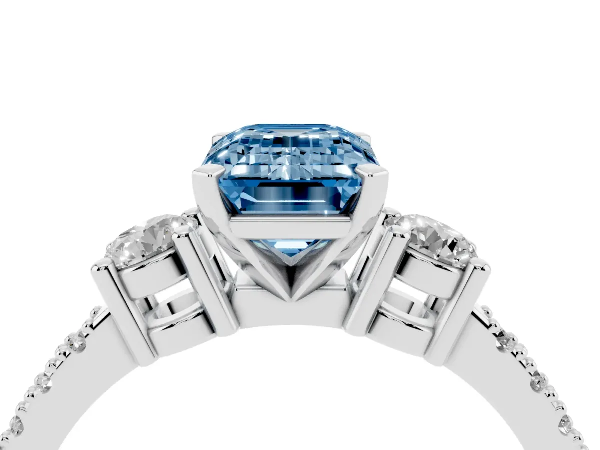 Fancy Blue Emerald Cut Three-Stone Diamond Pavé Band with Prong Setting Platinum