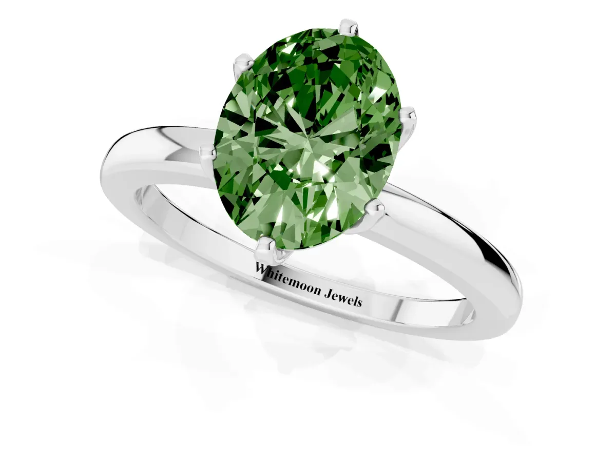 Fancy Green Oval Cut Solitaire Diamond Ring with Six-Prong Setting on a Classic Band Silver