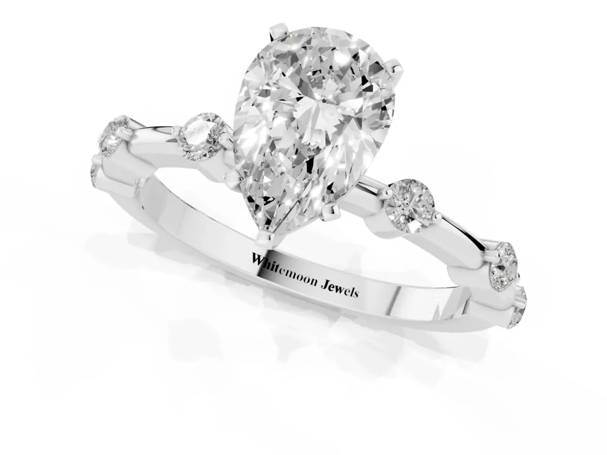 Pear Cut Solitaire Diamond Ring with Bezel Set Side Stones and Prong Setting White gold