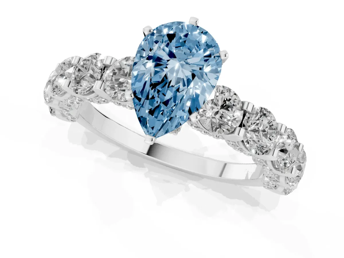 Fancy Blue Pear Cut Diamond Side Stone Engagement Ring with Four-Prong Setting White gold