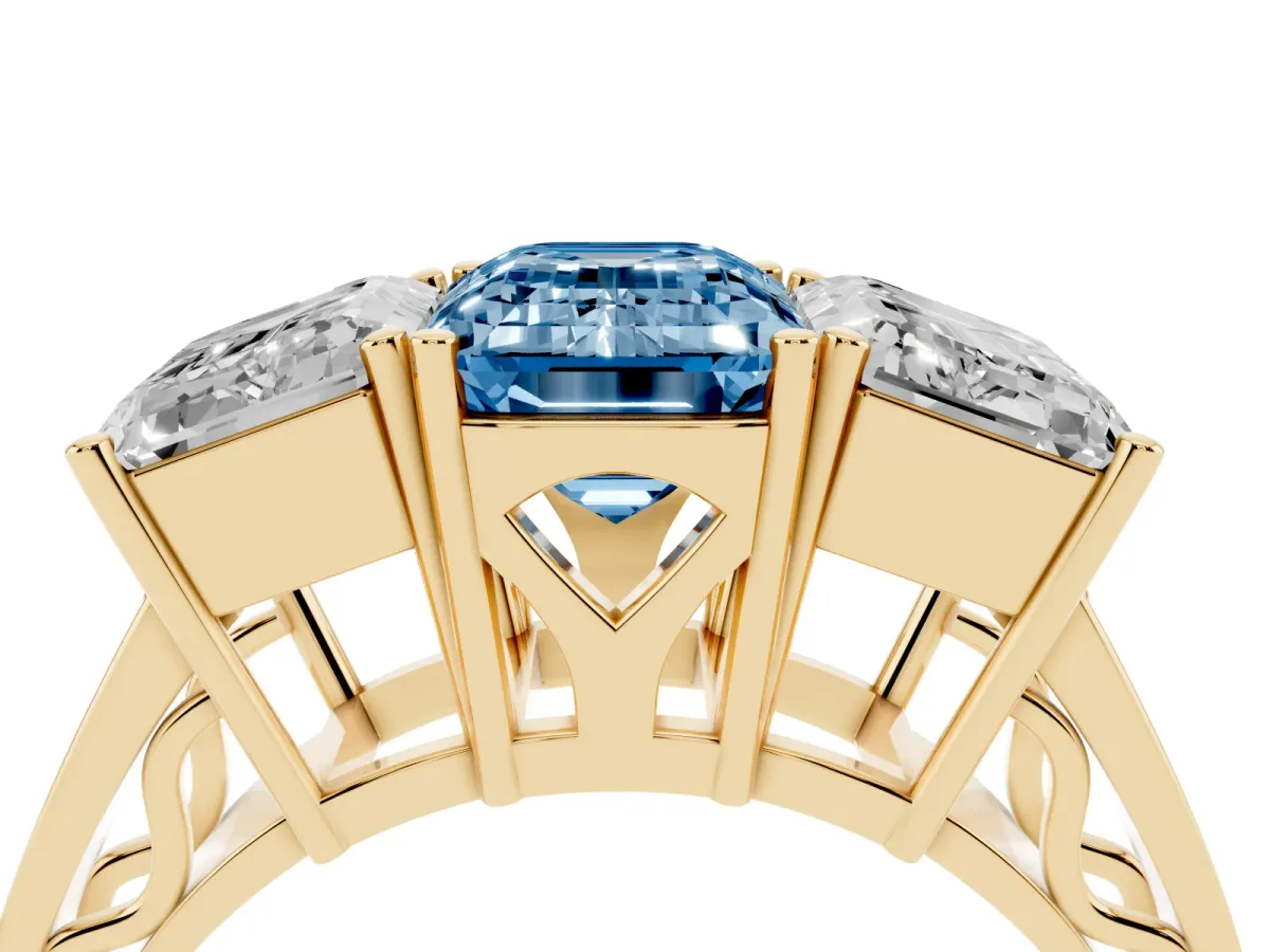 Fancy Blue Emerald Cut Diamond Three-Stone Ring with Prong Setting and Textured Band Yellow gold