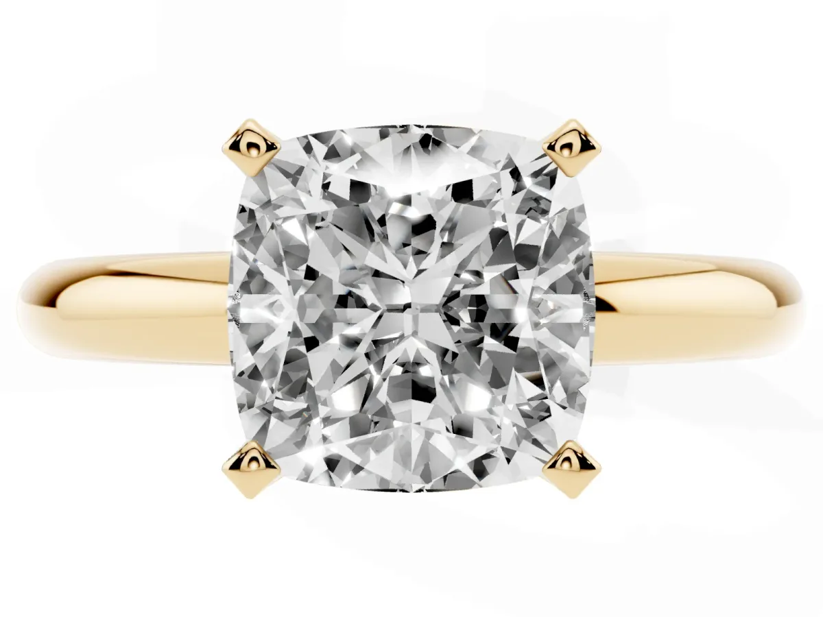 Cushion Cut Diamond Solitaire Engagement Ring with Round Band and Four-Prong Setting Yellow gold