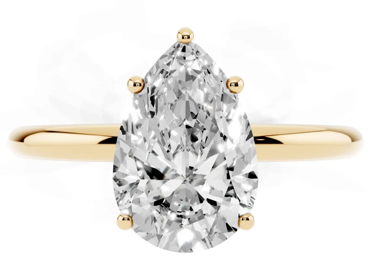 Pear Cut Solitaire Diamond Ring with a Classic Band and Four-Prong Setting Yellow gold