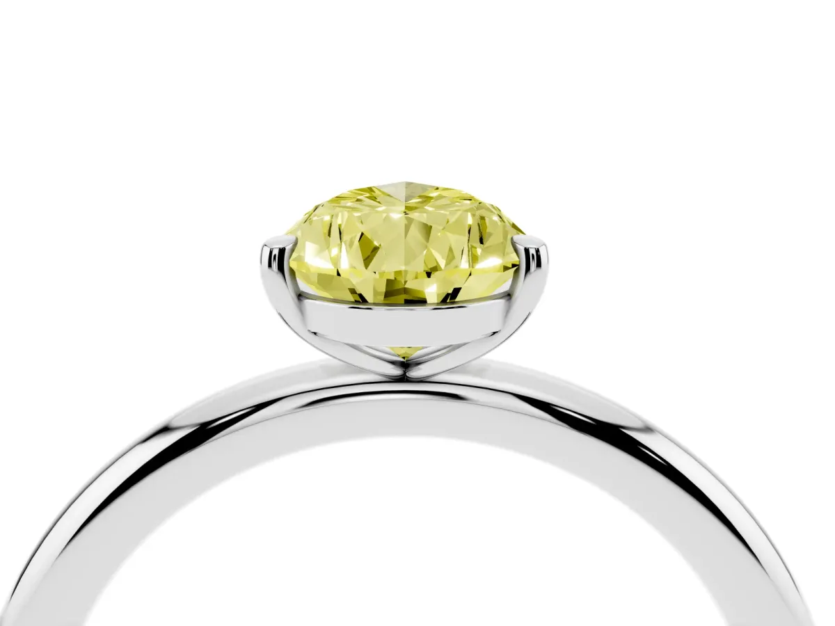 Fancy Yellow Pear Cut Solitaire Diamond Ring with Four-Prong Setting on a Plain Band White gold