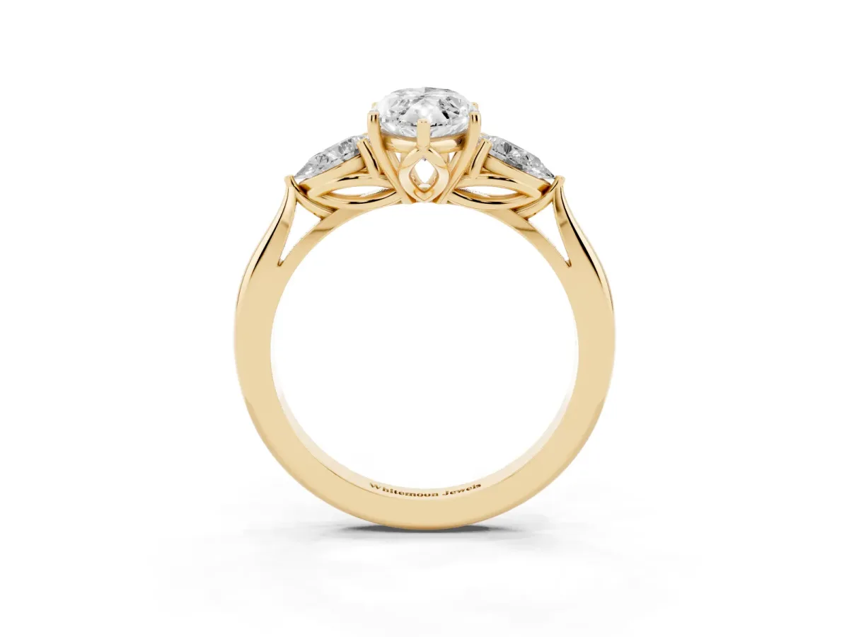 Marquise Cut Diamond Three-Stone Ring with Pear Side Stones and Prong Setting Yellow gold