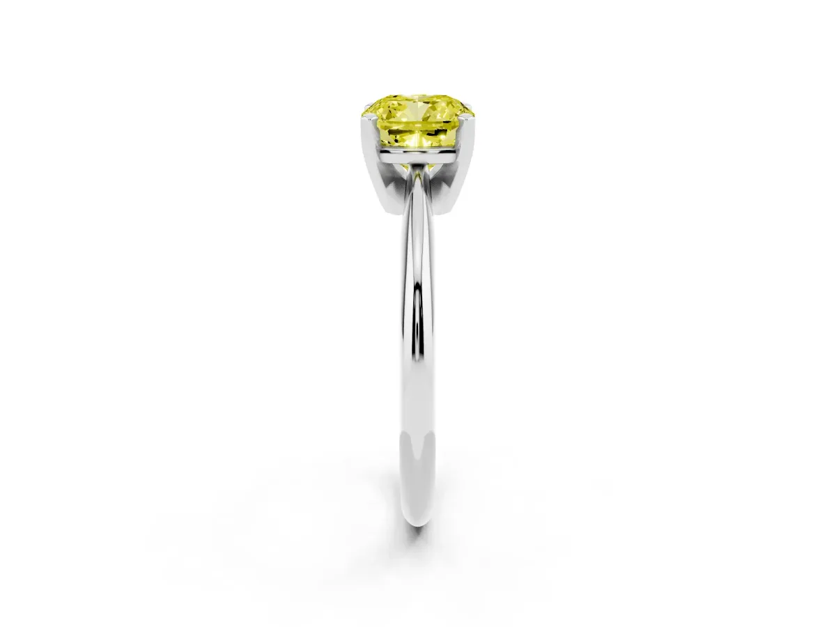 Fancy Yellow Cushion Cut Cut Solitaire Ring with Four-Prong Setting on a Classic Band Silver