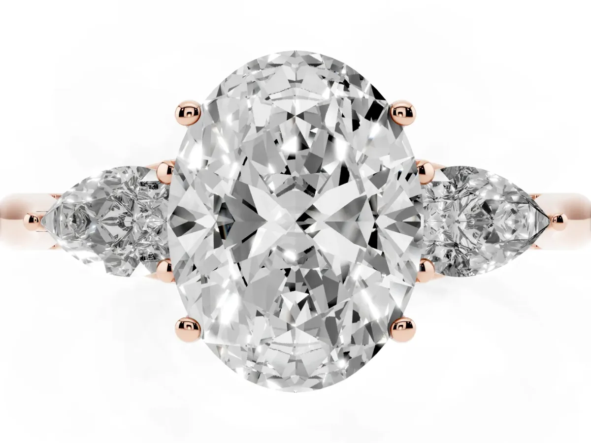 Oval Cut Diamond Three-Stone Ring with Pear Side Stones and Prong Setting Rose gold