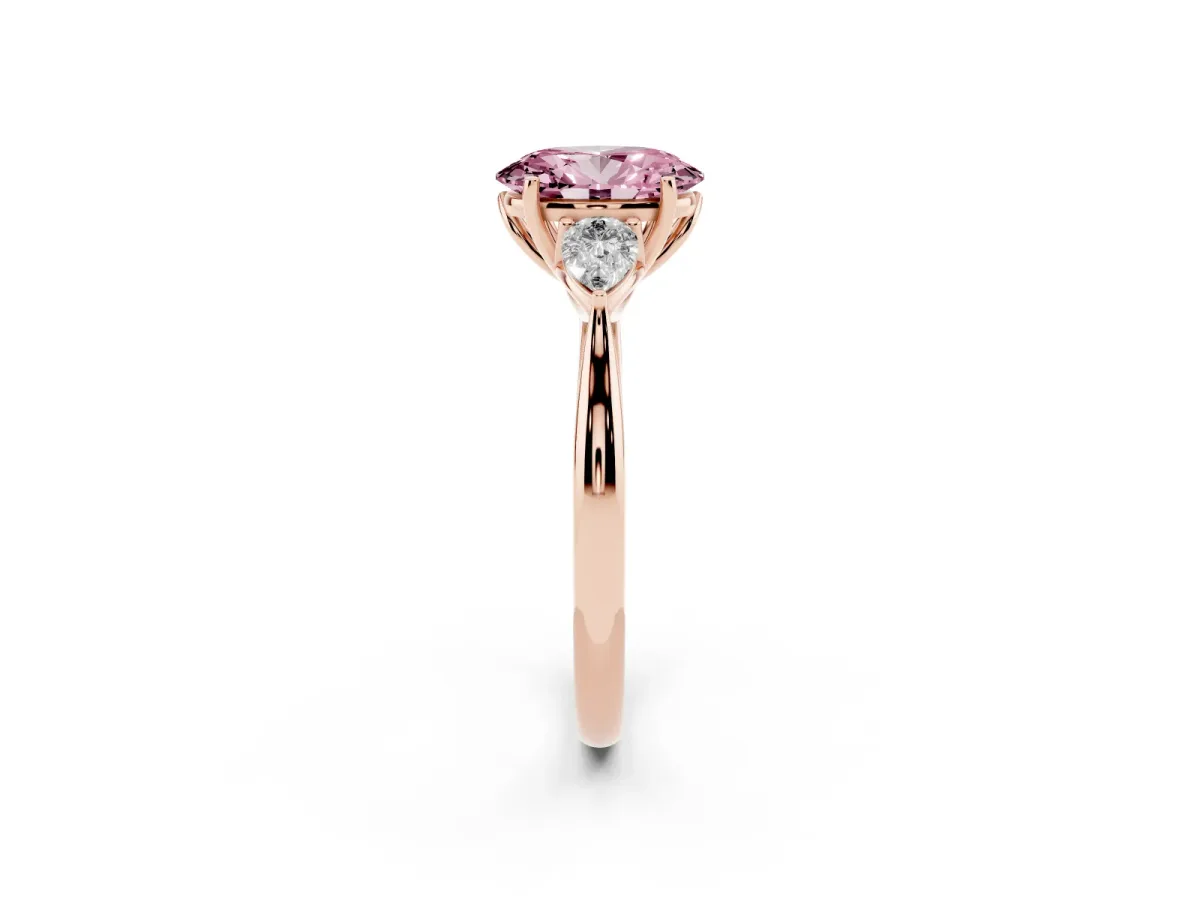 Fancy Pink Three-Stone Oval Cut Diamond Ring with Pear Side Stones in Four-Prong Setting Rose gold
