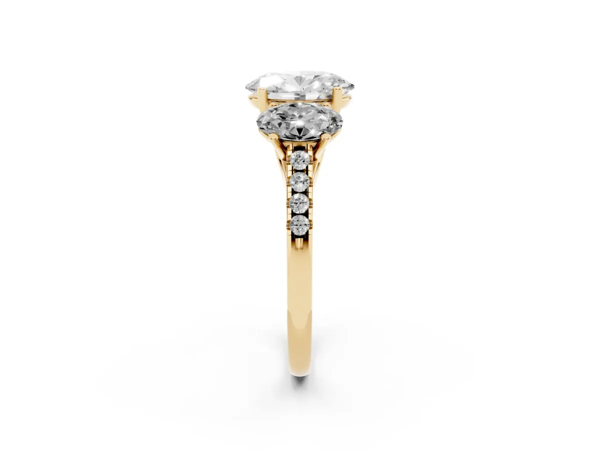 Three-Stone Oval Cut Diamond Ring with Round Pavé Band and Prong Setting Yellow gold