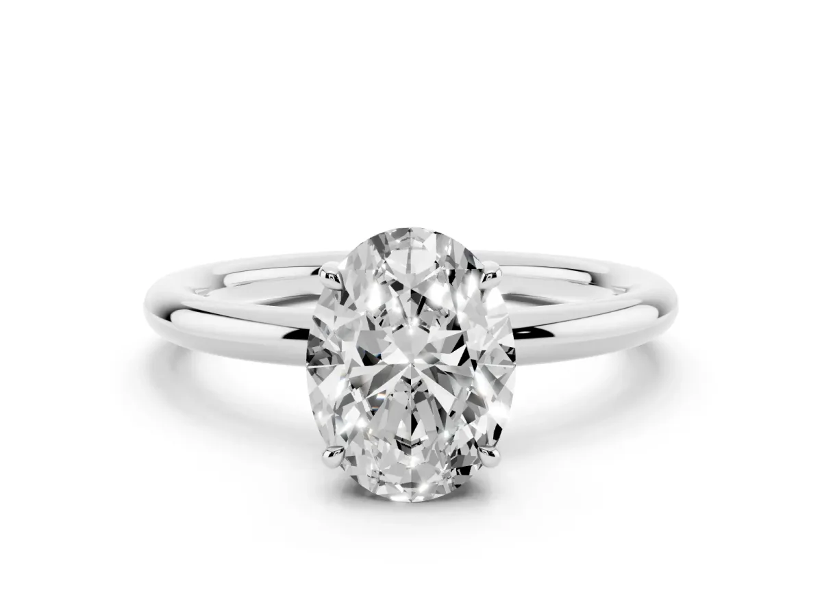 Oval Cut Diamond Solitaire Ring with Thin Band and Four-Prong Setting Silver
