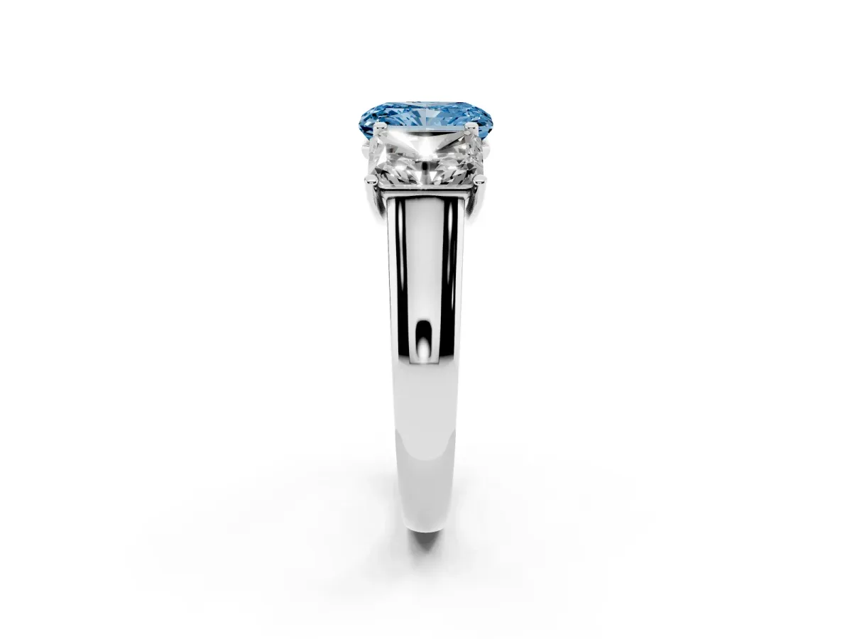 Fancy Blue Radiant Cut Three-Stone Diamond Ring with Prong Setting on a Classic Band Platinum