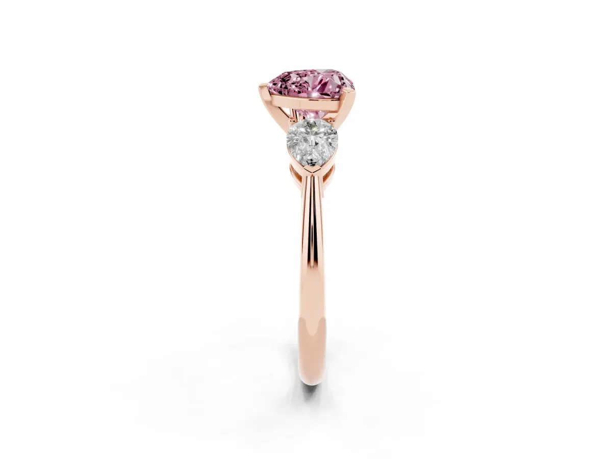 Fancy Pink Three-Stone Heart Cut Diamond Ring with Pear Side Stones and Four-Prong Setting Rose gold