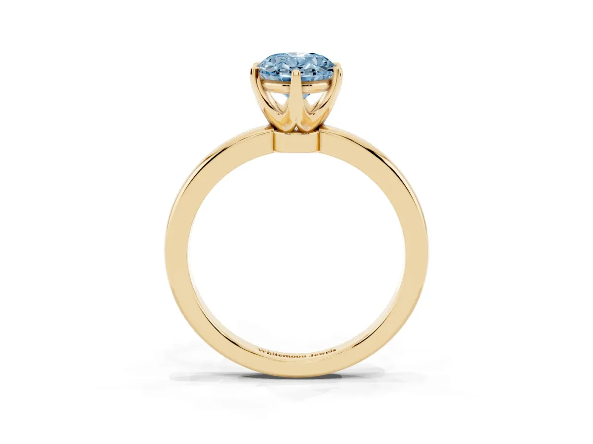 Fancy Blue Oval Cut Solitaire Diamond Ring with Six-Prong Setting on a Classic Band Yellow gold