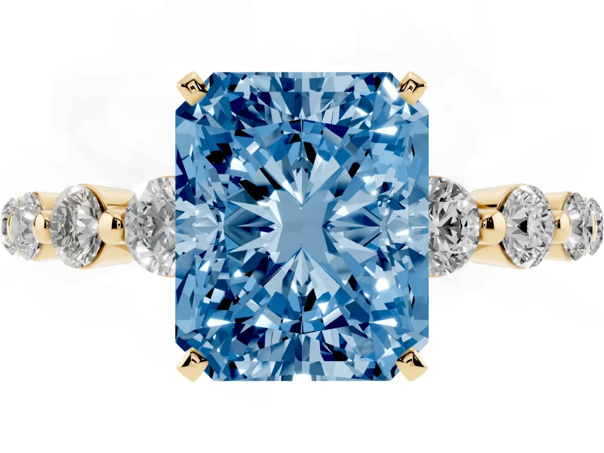 Fancy Blue Radiant Cut Solitaire Diamond Ring with Pave Band and Four-Prong Setting Yellow gold