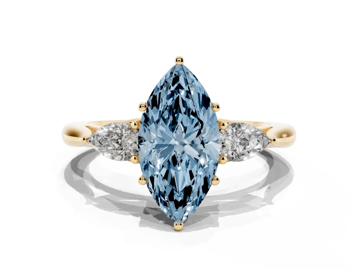 Fancy Blue Three-Stone Marquise Cut Diamond Ring with Pear Side Stones in Four-Prong Setting Yellow gold