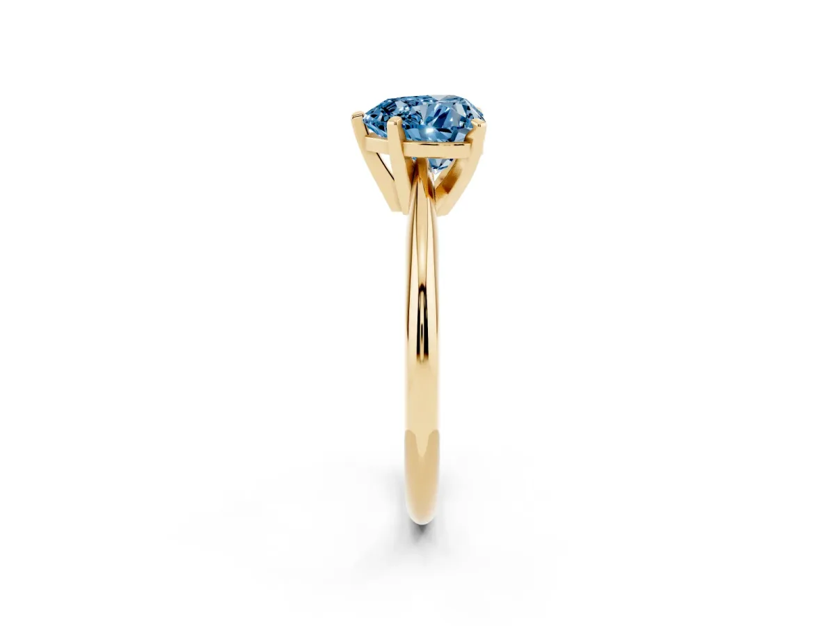 Fancy Blue Heart Cut Cut Solitaire Ring with Four-Prong Setting on a Classic Band Yellow gold