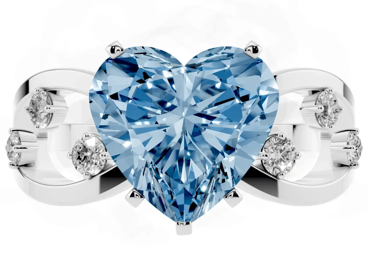 Fancy Blue Heart Cut Cut Solitaire Diamond with Side Stones on Criss-Cross Band and Four-Prong Setting Silver