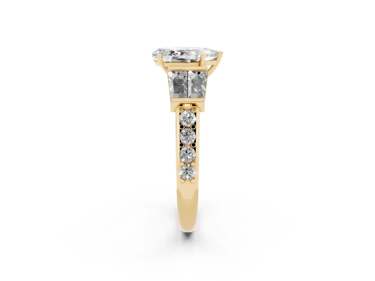 Pear Cut Diamond Engagement Ring with Baguette Side Stones and Channel Set Band Yellow gold