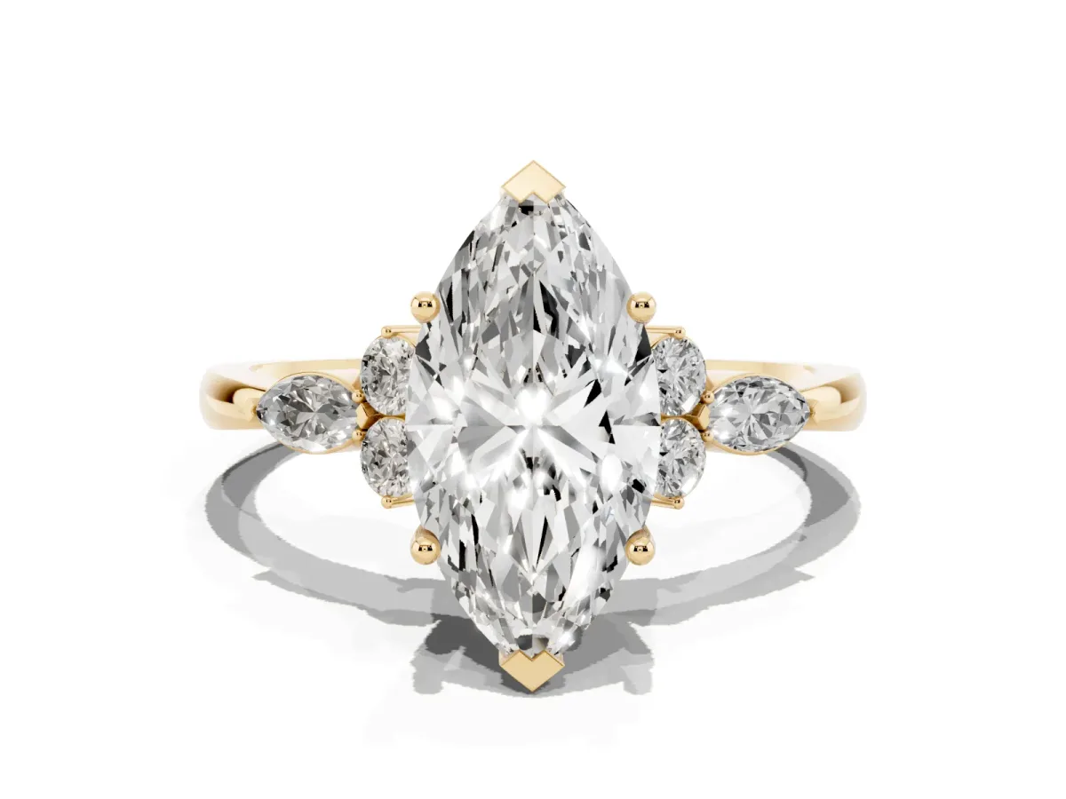 Marquise Cut Brilliant Diamond Solitaire Ring with Pear Side Stones and Four-Prong Setting Yellow gold