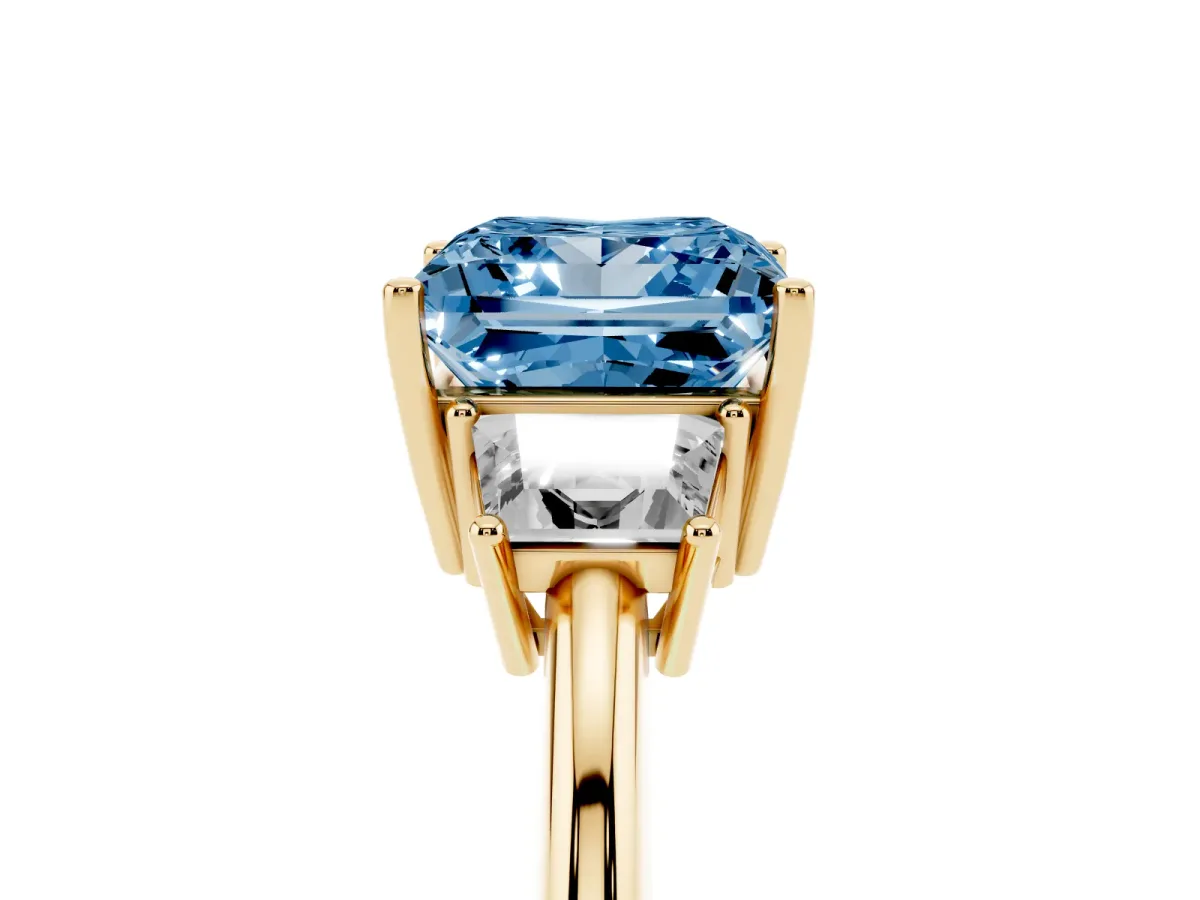 Fancy Blue Princess Cut Diamond Three-Stone Ring with Trapezoid Side Stones and Prong Setting Yellow gold