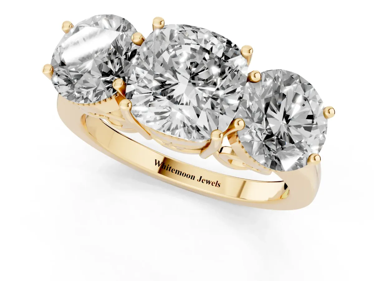 Three-Stone Cushion Cut Diamond Engagement Ring with Prong Setting on a Classic Band Yellow gold