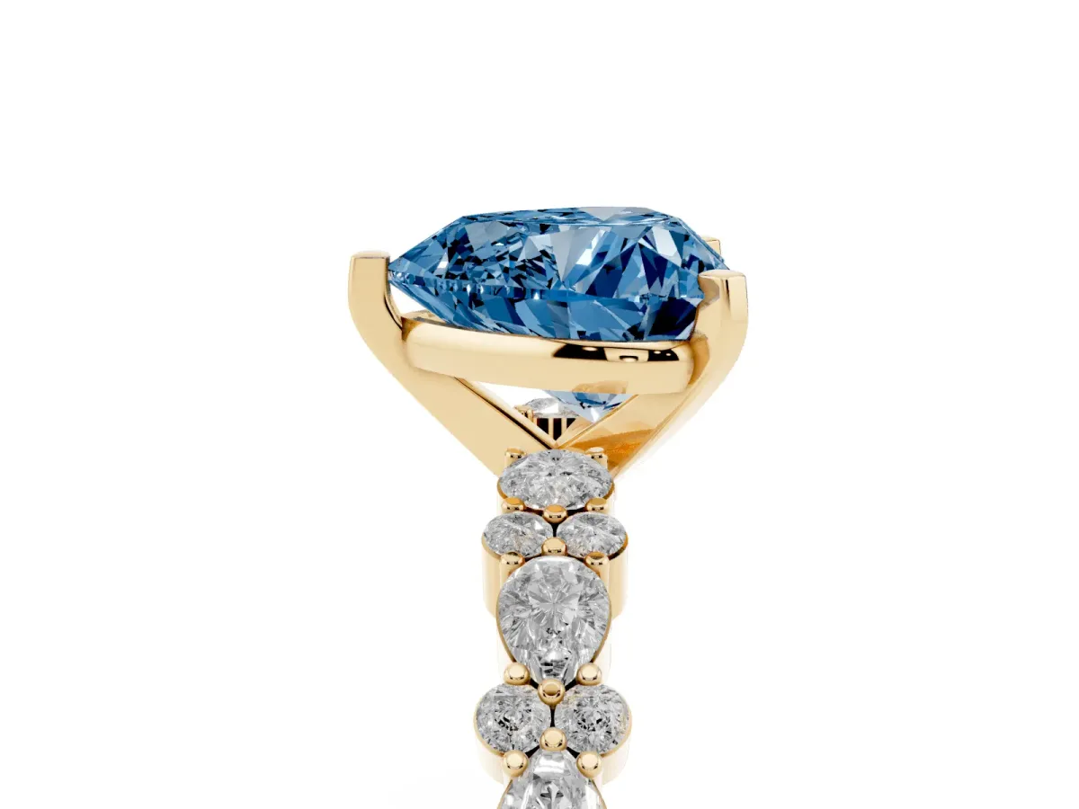 Fancy Blue Heart Cut Diamond Side Stone Solitaire Ring with Round and Four-Prong Setting Yellow gold