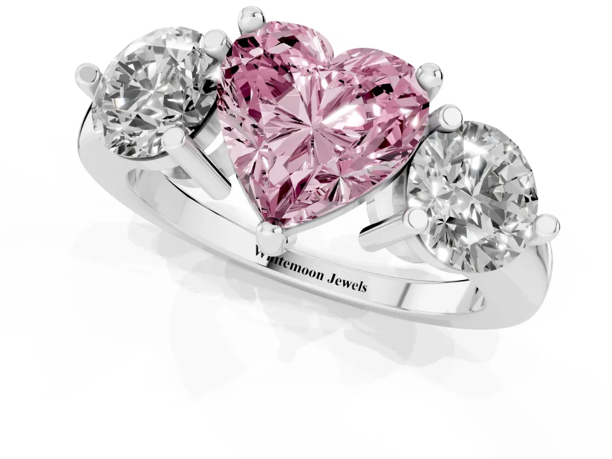 Fancy Pink Three-Stone Heart Cut Brilliant Cut Solitaire Ring with Prong Setting on a Classic Band White gold