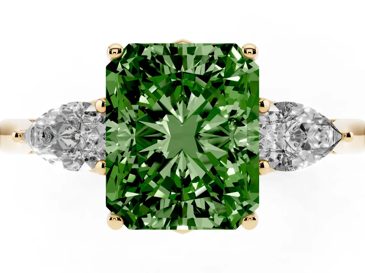 Fancy Green Three-Stone Radiant Cut Diamond Ring with Pear Side Stones in Four-Prong Setting Yellow gold