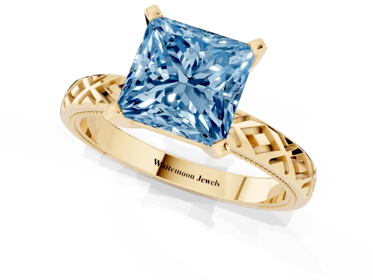 Fancy Blue Princess Cut Solitaire Diamond Ring with Milgrain and Black Enamel X Pattern Band Yellow gold