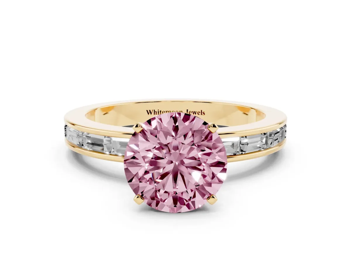 Fancy Pink Round Cut Solitaire Diamond Ring with Channel-Set Baguette Band and Four-Prong Setting Yellow gold