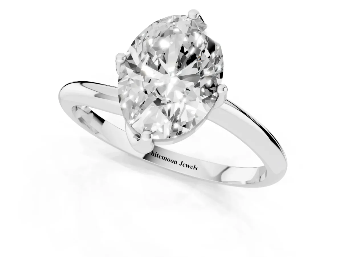 Oval Cut Diamond Solitaire Engagement Ring with Four-Prong Setting and Classic Band Silver
