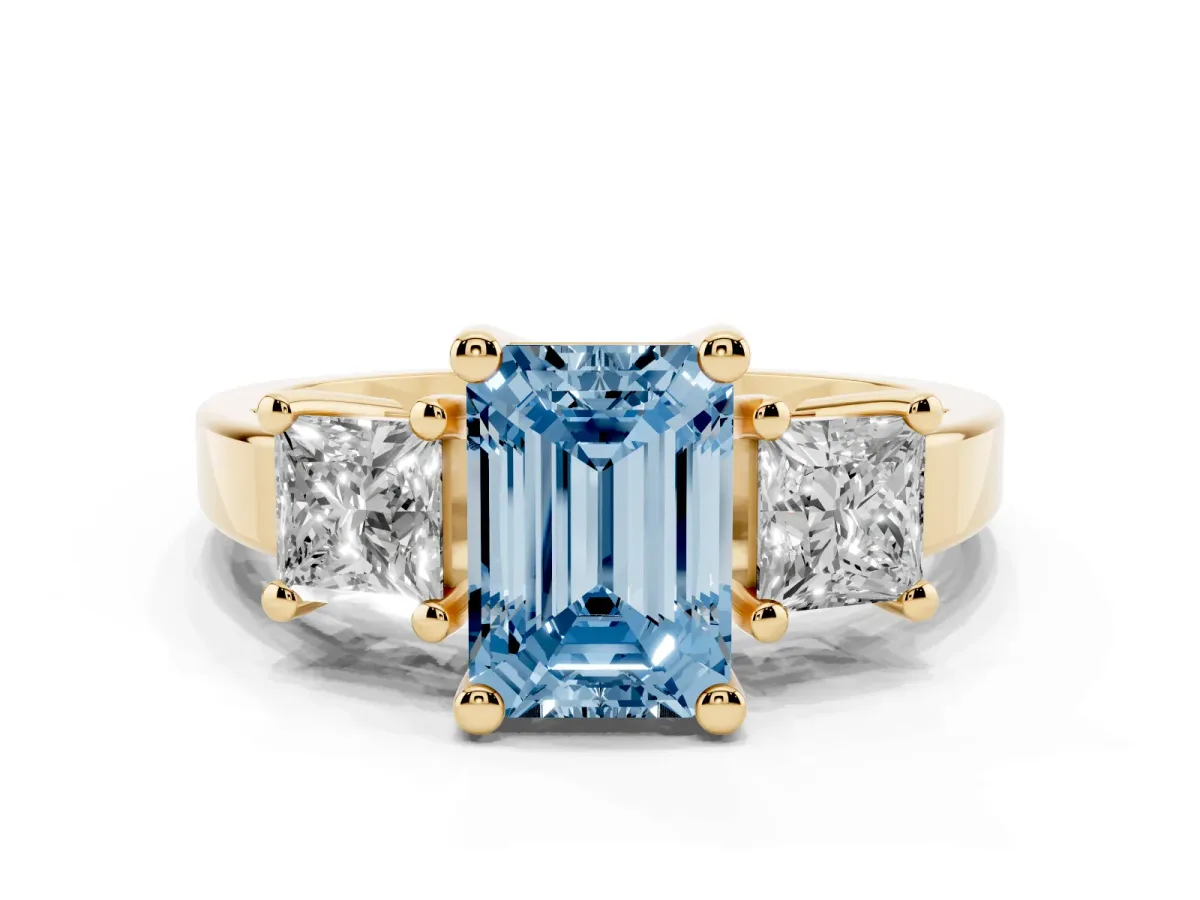 Fancy Blue Three-Stone Emerald Cut Cut Solitaire Ring with Prong Setting Yellow gold