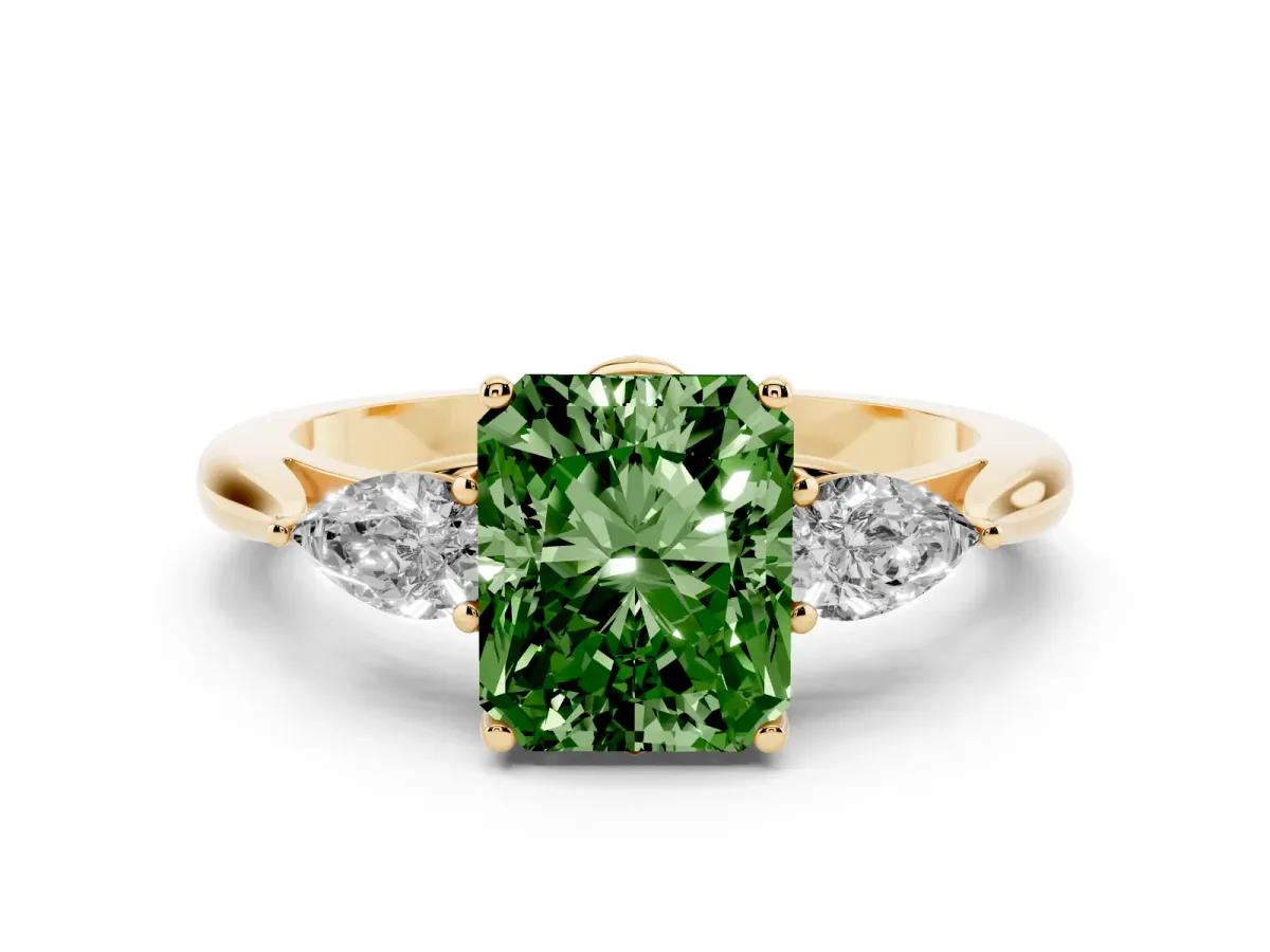 Fancy Green Three-Stone Radiant Cut Diamond Ring with Pear Side Stones in Four-Prong Setting Yellow gold