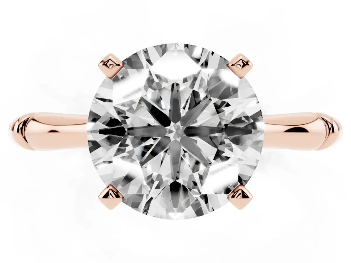 Round Cut Solitaire Diamond Ring with Bamboo Band and Four-Prong Setting Rose gold