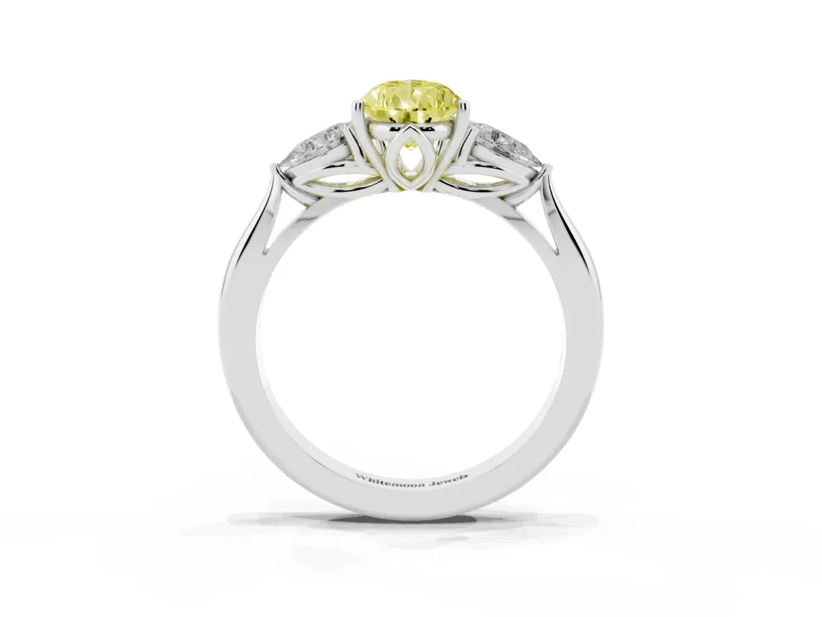 Fancy Yellow Three-Stone Pear Cut Diamond Ring with Pear Side Stones in Four-Prong Setting Platinum