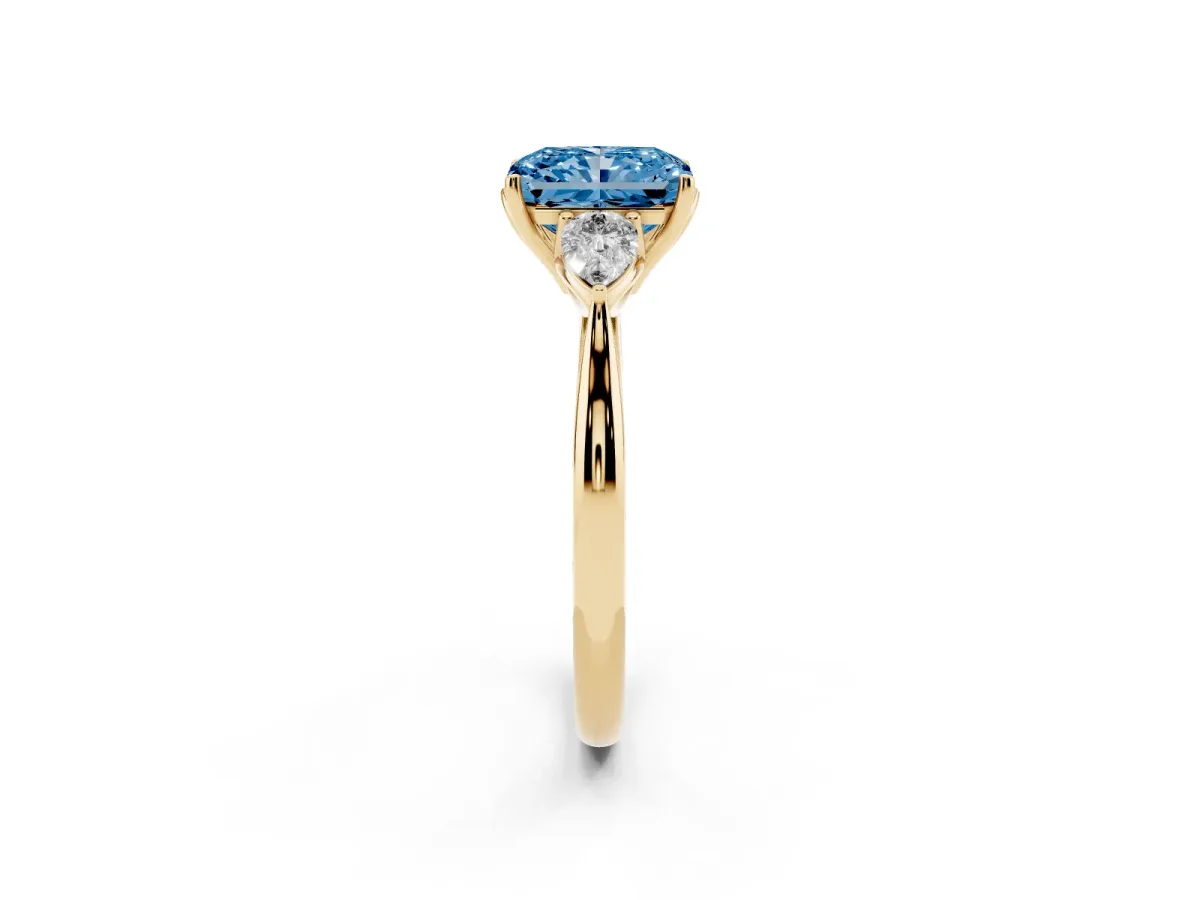 Fancy Blue Three-Stone Radiant Cut Brilliant Diamond Solitaire Ring with Tapered Band and Four-Prong Setting Yellow gold
