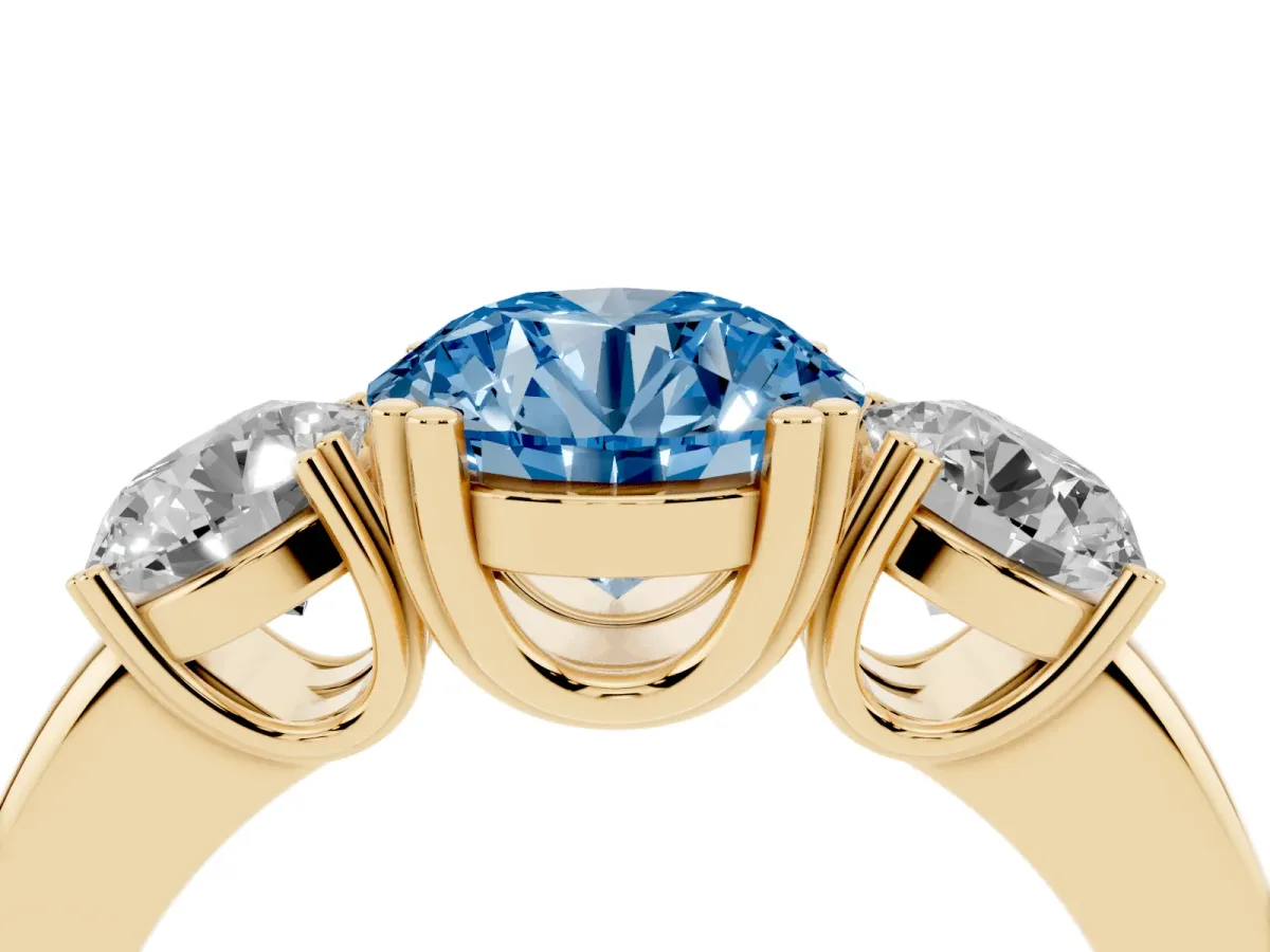 Fancy Blue Three-Stone Round Cut Cut Diamond Ring with Channel Set Band and Four-Prong Setting Yellow gold
