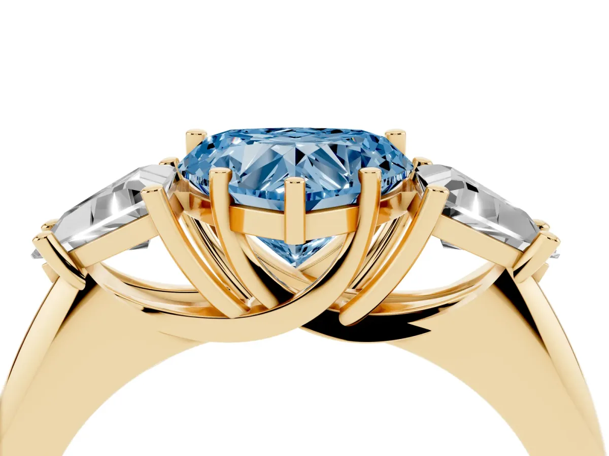 Fancy Blue Three-Stone Heart Cut Diamond Engagement Ring with Trillion Side Stones and Prong Setting Yellow gold