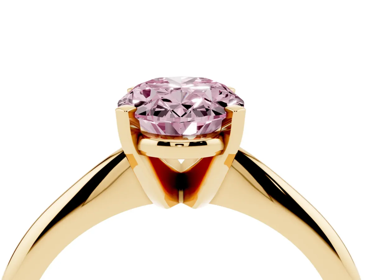 Fancy Pink Oval Cut Cut Solitaire Ring with Four-Prong Setting on a Classic Band Yellow gold